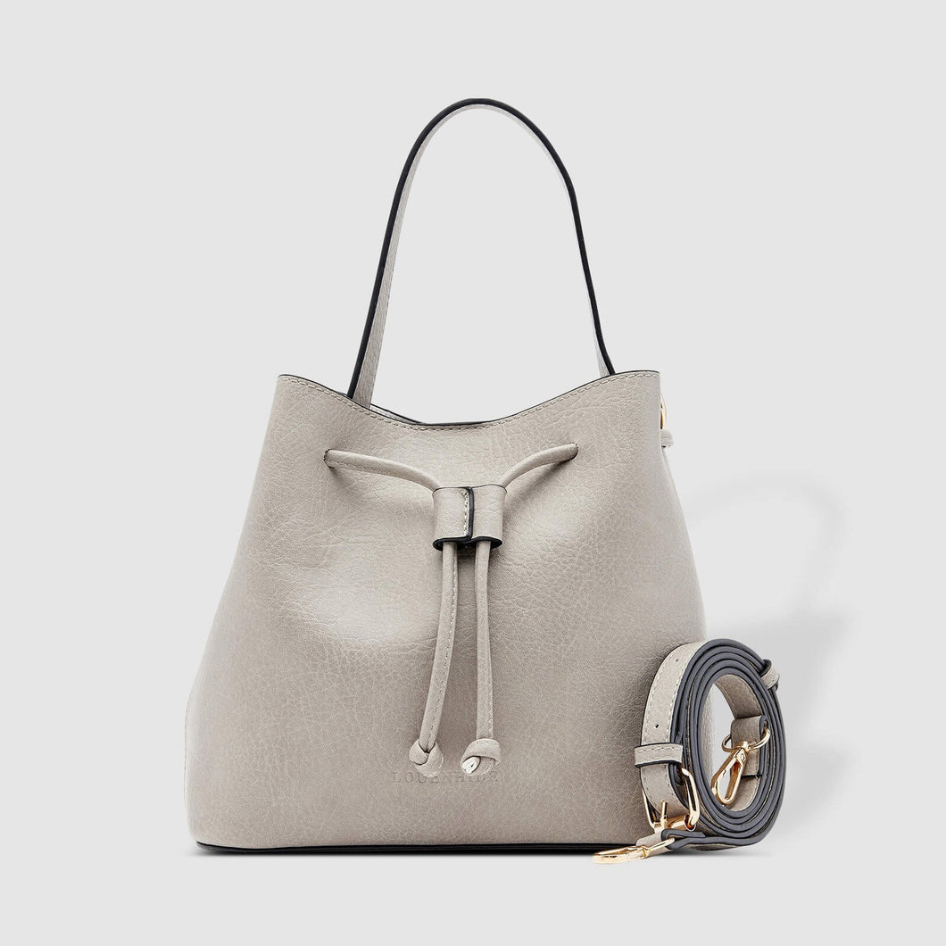 Complete with a drawstring closure, the Sasha is perfect for your next brunch with the girls, or a day out on the town.  Wear it your way and sling over your shoulder for a more casual look or carry by her top handle for a dressier option.  Features:  1 Slip Pocket Internal lining - Vegan Leather Extension strap: 114-128cm Adjustable Detachable Closure: Magnetic Clasp with Draw String Material: Vegan Leather  Hardware: Light Gold  Dimensions: W26 x H23 x D14 cm 