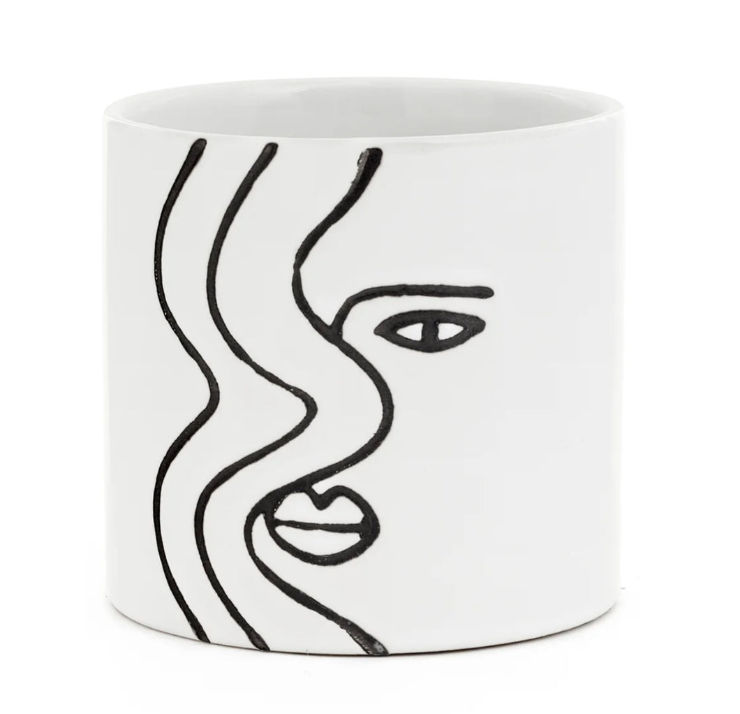 So simple, yet stricking!  This beautiful ceramic planter captures the Face Silhouette so elegantly with its hand-painted design.  It is so versatile it can be used for gorgeous plants, or get creative and use it as a home decor piece on your coffee table or bookshelf.  You can also put it in your office or kitchen for pens, spoons, etc.  Makes a great gift too!  Size:  4