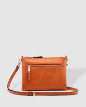Load image into Gallery viewer, This Tan Holly crossbody bag is the ultimate accessory.   Stylish, yet practical.  Great for travel and you will be amazed at how much fits in there.  Features:  1 Zip Pocket 1 Flat Pocket Internal lining - Black/White Stripe Strap: 110cm Adjustable Detachable Closure: Zip Closure Material: Suedette Vegan Leather  Hardware: Light Gold  Dimensions: W24 x H16 x D8 cm
