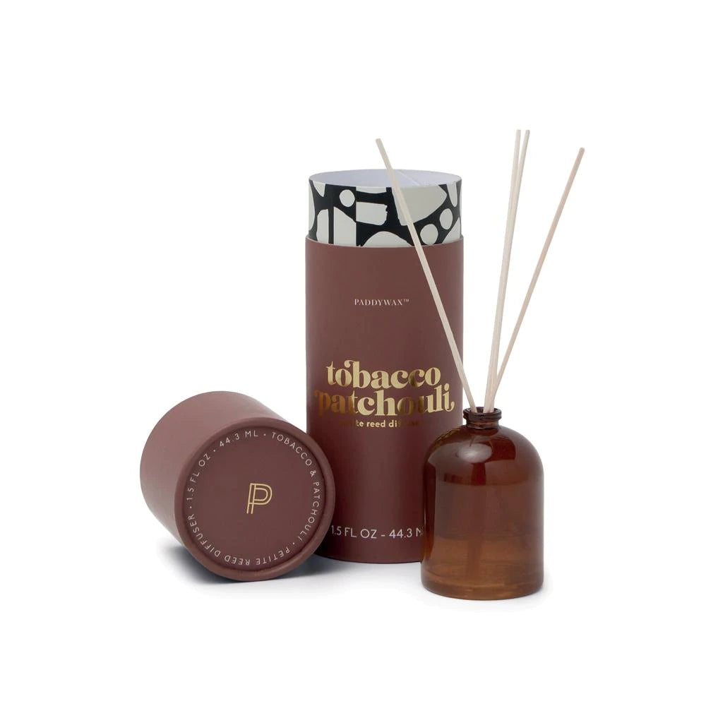 Milky glass bottles with four wooden reeds. Each diffuser is packaged in a giftable tube with gold foil. Flip the reeds for a fragrance refresh!  Top Notes: Cinnamon, Nutmeg Middle Notes: Patchouli, Vetiver Base Notes: Tobacco, Sandalwood, Creamy Vanilla  Clean Burning Vegan Sustainable Size: 1.5 oz. Vessel: Glass Dimensions: 1.875