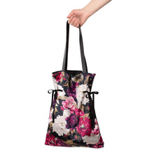 Load image into Gallery viewer, Arrive in style with this satin-lined bohemian black and floral velour tote bag. Perfect for carrying your shoes, groceries, laptop, etc.  Super soft and features two ties on the sides to cinch it when necessary.  Make your next gift extra special by swapping the traditional gift bag for this luxurious tote instead!  Measures: 18&quot;L x 14&quot;W, 22&quot; L handle  Materials: Polyester Machine wash in cold water, gentle cycle.  Lay flat to dry.
